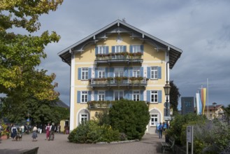 Historic town hall, tourists on the promenade on the shores of Tegernsee, town of Tegernsee, Upper