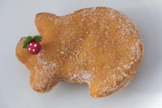 Traditional lucky pig cake served on a plate, as a sweet New Year's pastry and symbol of good luck