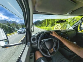 Pov driving a vehicle on the scenic icefields parkway in the canadian rockies with mountains and