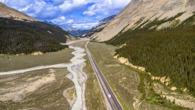 Sunti creek is flowing along the icefields parkway in the canadian rockies of jasper national park