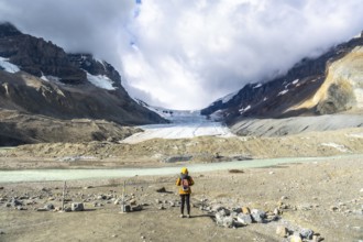 Majestic view of the athabasca glacier in jasper national park, alberta, canada, with a tourist