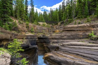Water flowing through mistaya canyon in banff national park, alberta, canada, creating a stunning