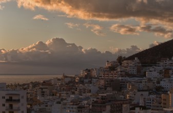 Urban panorama at sunset with clouds and coastal views, Los Cristianos, Tenerife