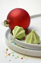 Meringue on plate, Christmas cookies, meringue and Christmas tree ball