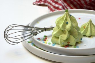 Meringue in the shape of a Christmas tree and whisk, Christmas cookies, meringue