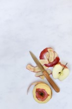 Peel apples with a knife, apple peels