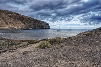 View of boats in coastal waters under dramatic skies, Los Cristianos Tenerife
