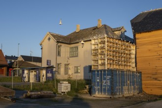 Building with nesting boxes for kittiwakes (Rissa tridactyla) made of old fishing boxes and flying