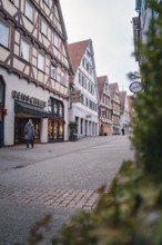 Charming old town street with half-timbered houses and small shops, Herrenberg, Böblingen district,