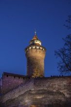 Sinwell tower illuminated in the evening, built in the 13th century, Kaiserburg, Nuremberg, Middle