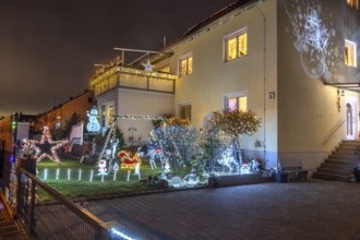 Illuminated Christmas decoration in the garden of a residential building, Nuremberg, Bavaria,