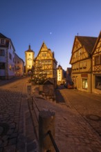 December 25, 2025: Christmastime at Plönlein — Rothenburg ob der Tauber, Bavaria, Germany. Festive