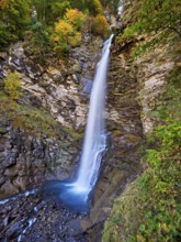 Diesbach waterfall in autumn-colored surroundings, Linthal, Klausenpass, Canton of Glarus,