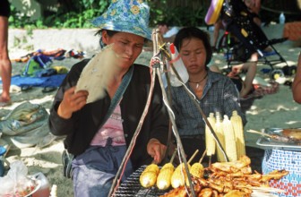 Woman and daughter with food stash on Pranang Cave beach, two years in front of the tsunami, Krabi,