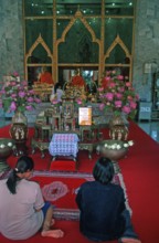Believers pray at Wat Chalong monastery, Ko Phuket, Thailand, December 2002, vintage, retro, old,