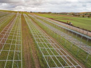 Solar system under construction in fields in a rural landscape, energy transition, construction of