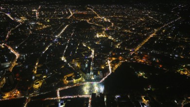 A Drone night view of Aleppo, Syria on December 19, 2025, showing illuminated streets, dense