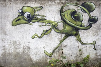 Grafity on an old wall, dilapidated plant of a former agricultural production cooperative of the