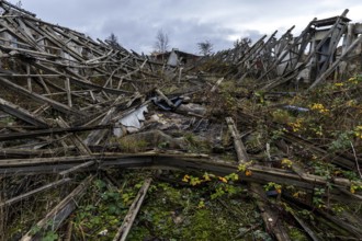 Dilapidated hall of the dilapidated plant of a former agricultural production cooperative of the