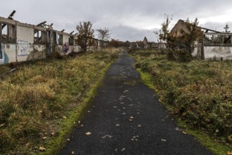 Dilapidated halls of the dilapidated plant of a former agricultural production cooperative of the