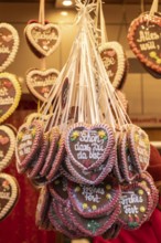 Colourful gingerbread hearts hang on the festive stands at the Stuttgart Christmas market. They are