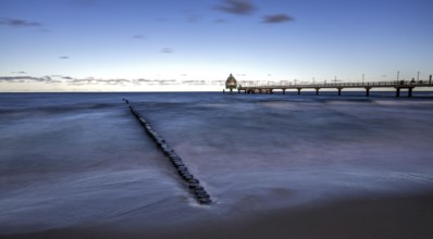 Groes and pier with diving gondola, panorama, long exposure, evening light, Zingst,
