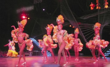 Revue dancers in opulent colorful costume and with feather headdress at Club Tropicana, Havana,