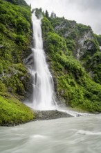 Horsetail Falls waterfall on the Lowe River in a green gorge, long exposure, Keystone Canyon,