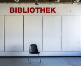 Empty chairs stand in front of access to a library, Berlin, Germany, which has been closed due to