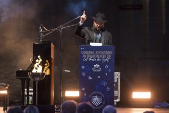 Yehuda Teichtal (Rabbi of the Chabad-Lubavitch movement) speaks at the lighting of lights to mark