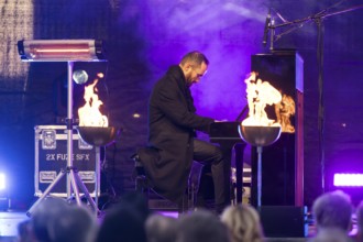 Igor Levit (pianist) plays the piano at the lighting of the 20th anniversary Hanukkah in front of