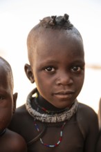 Portrait, curious Himba child, traditional Himba village, Kaokoveld, Kunene, Namibia
