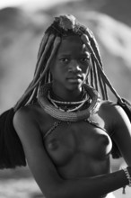 Black and white, young Himba woman with jewelry, portrait, traditional Himba village, Kaokoveld,