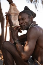 Elderly man, leader of the Himba, traditional Himba village, Kaokoveld, Kunene, Namibia