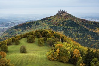 Castle and autumnal forest, Hohenzollern Castle, Hechingen, Swabian Jura, Baden-Württemberg,