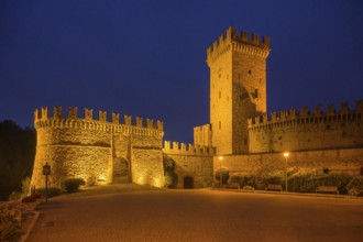 The castle and defensive walls illuminated, Borgo di Vigoleno, Vernasca, Province of Piacenza,