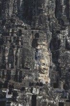 Huge stone-carved faces of Bodhisattva Lokeshvara, also Avalokiteshvara, Bayon Temple, Angkor Thom,
