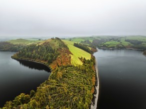 Autumn colours over Llyn Clywedog and Clywedog Reservoir from a drone, Llanidloes, Wales, UK