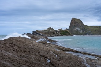 Deliverance Cove and Castle Rock, rocks, ocean, surf. Castlepoint, Wairarapa Coast, Wellington