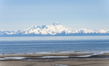 Beach at Anchor Point, Cook Inlet, glaciated mountain peaks of the Aleutian Range with Mount