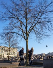 Tourists at the Memorial to the Murdered Jews of Europe, Behrenstraße, Berlin, Germany