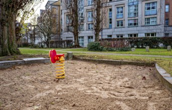Orphaned children's playground with sandbox and small play equipment, Berlin, Germany