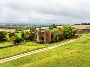 Autumn Colours over ruins of Pembridge Castle or Newland Castle from a drone, Herefordshire,