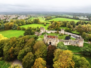 Autumn Colours over ruins of Caldicot Castle from a drone, Caldicot, Monmouthshire, Wales, UK