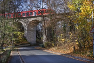 Regional train crosses the historic railway bridge, viaduct in Lauf, built in 1876,
