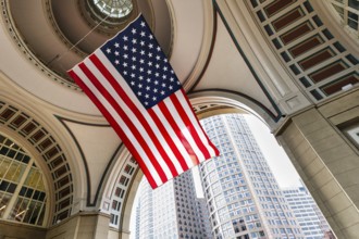 American flag fluttering, distinctive archway, Boston Harbor Hotel, Rowes Wharf, Freedom Trail,