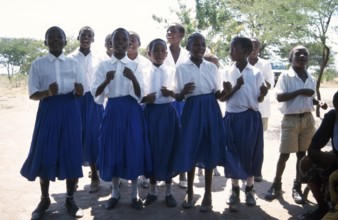 Children from a World Vision project dance on the occasion of a godfather's visit, Nyabubinza,