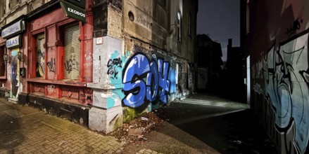 Decaying façade smeared with graffiti, scrap property in a no-go area, Gelsenkirchen, Ruhr area,