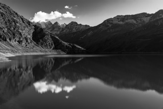 The Lac de Moiry reservoir, in the background the peaks of the Grand Cornier, Tete Blanche and