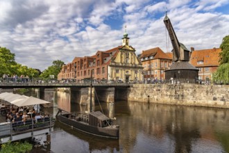 Old harbour with crane and hotel department store in the Hanseatic city of Lüneburg, Lower Saxony,